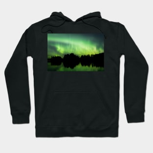 Northern lights glowing over lake in Finland Hoodie